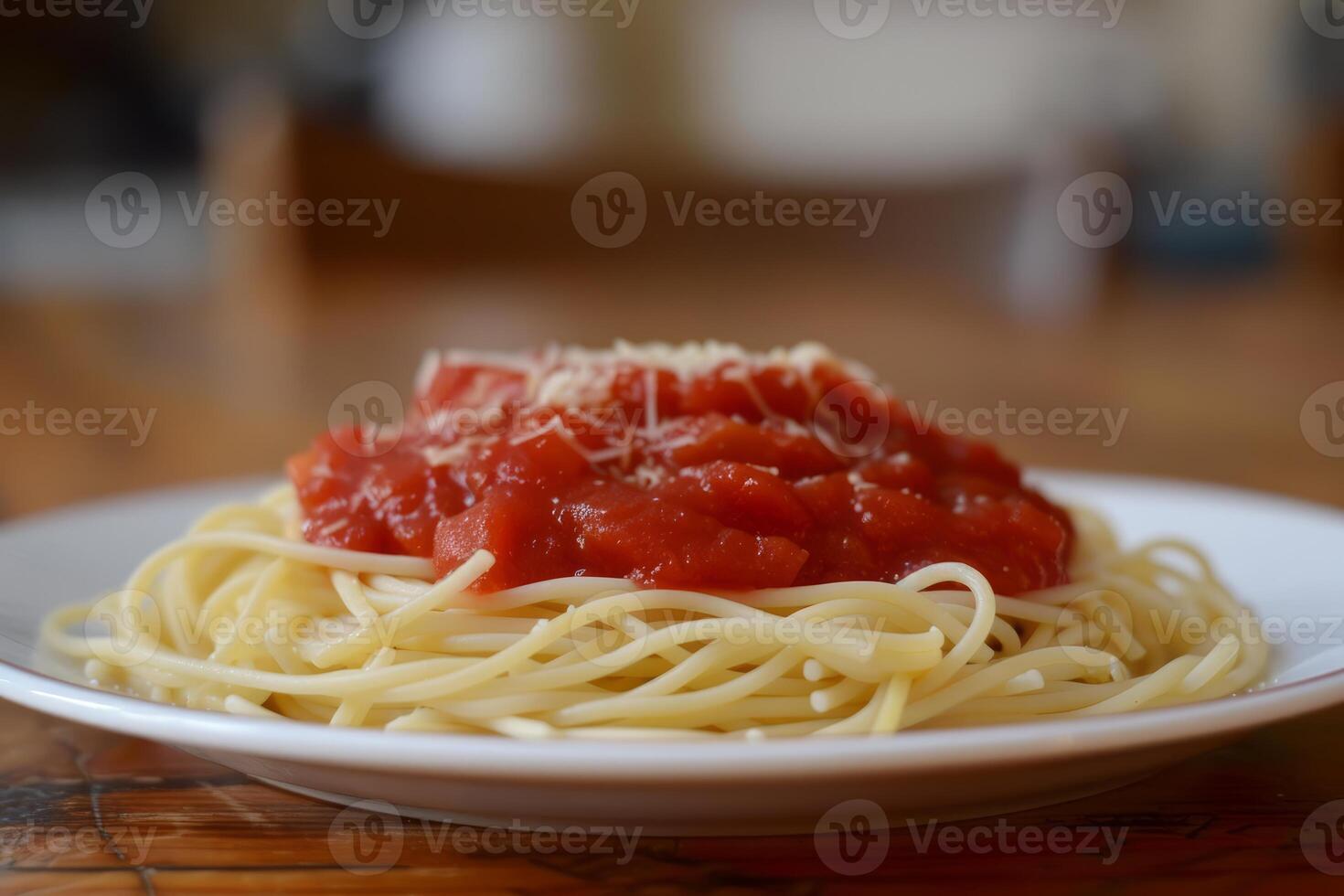 Spaghetti with tomato sauce and parmesan cheese photo