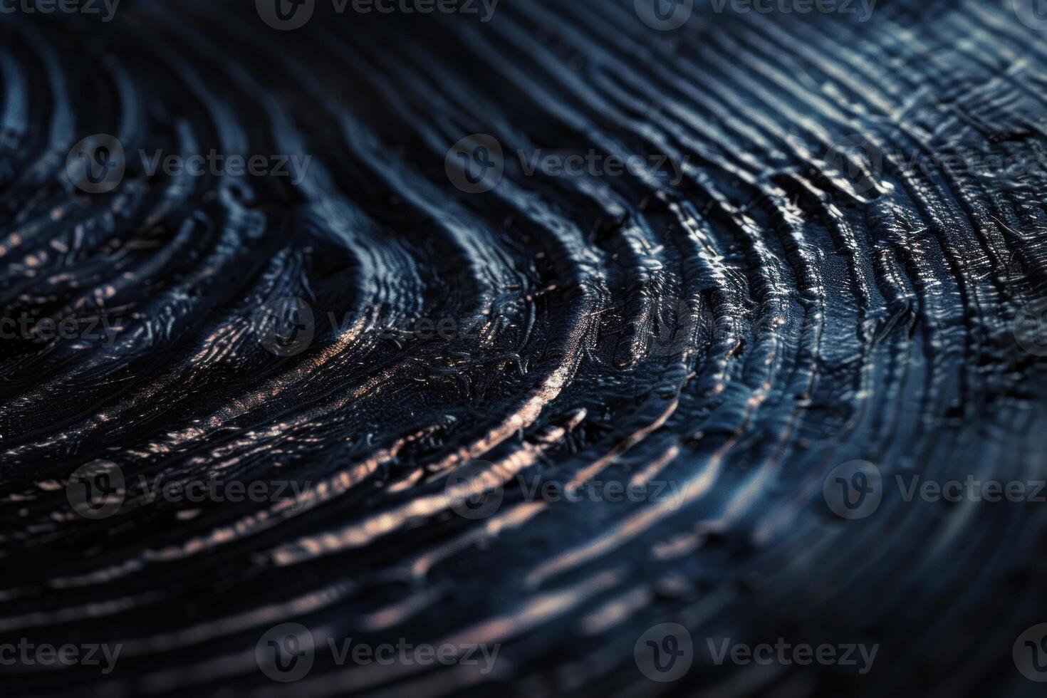 Close up of dark swirling patterns with intricate textures and moody lighting photo