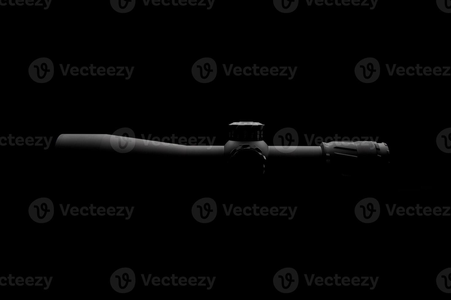 Modern sniper scope on a dark back. Optical device for aiming and shooting at long distances. photo