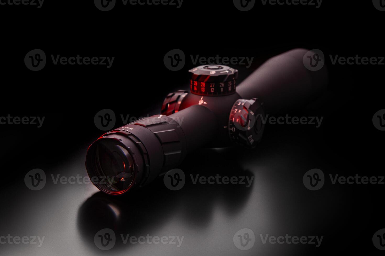 Modern sniper scope on a dark back. Optical device for aiming and shooting at long distances. photo