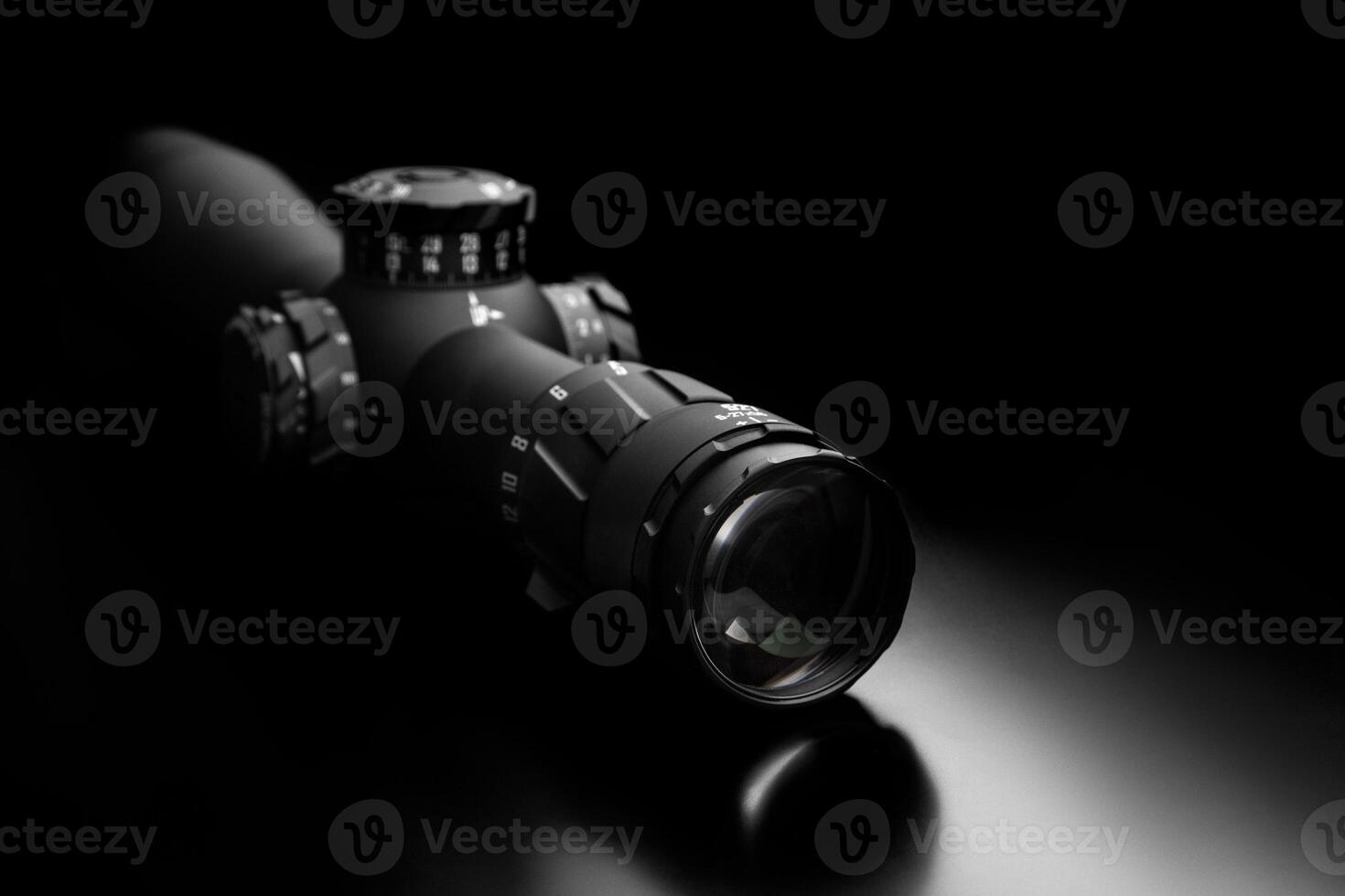 Modern sniper scope on a dark back. Optical device for aiming and shooting at long distances. photo
