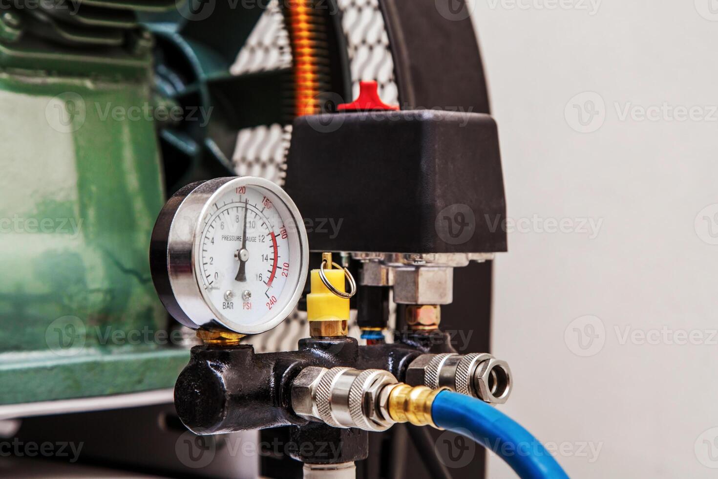 A close-up of the manometer of a modern compressor. photo