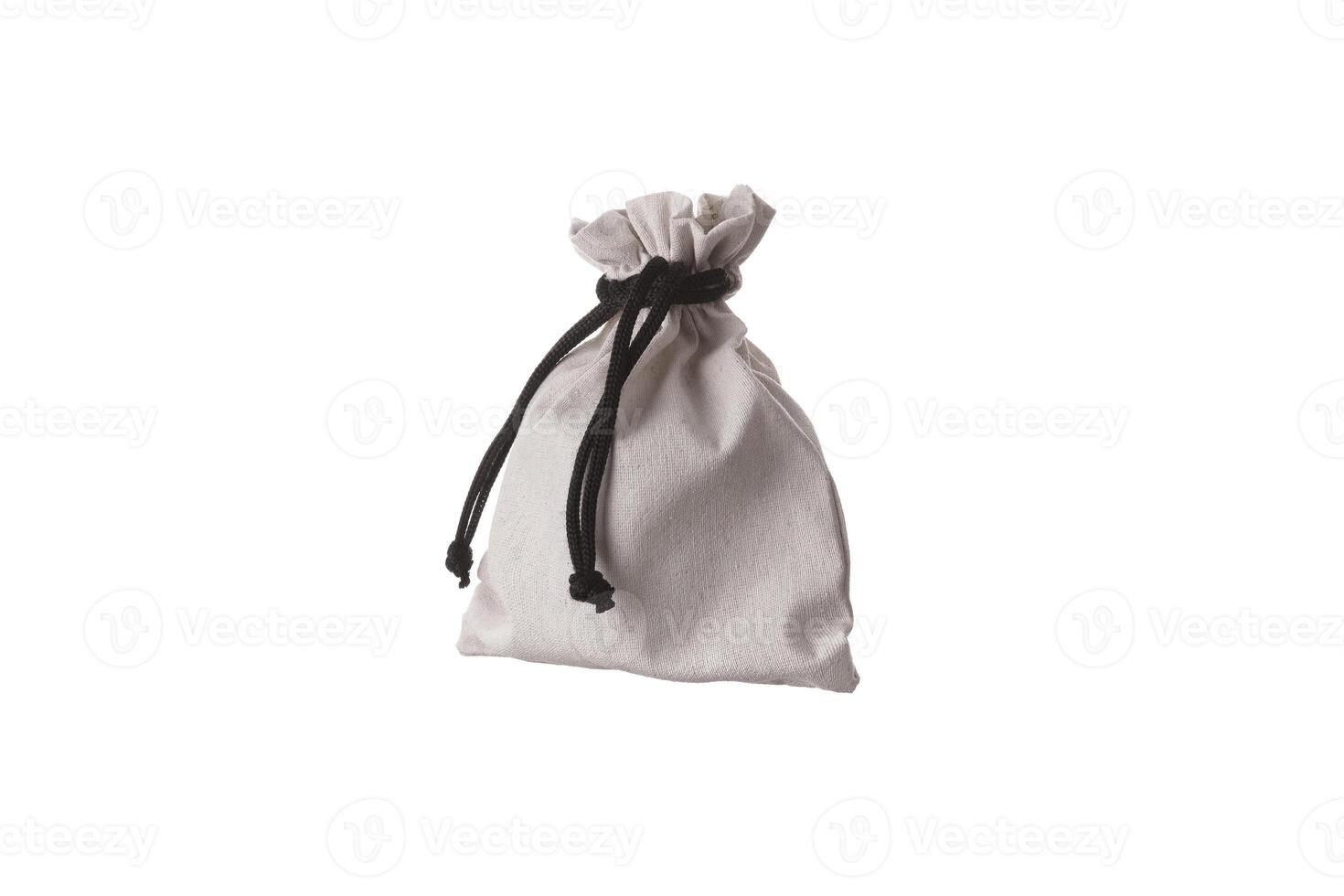 Small fabric pouch with a drawstring for tying. Isolate on a white back photo