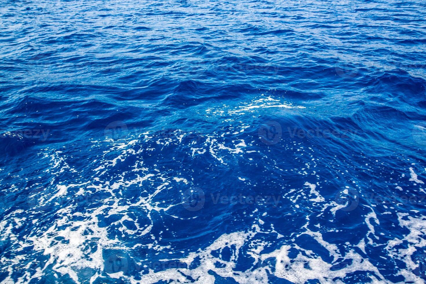 blue sea and white foam photo