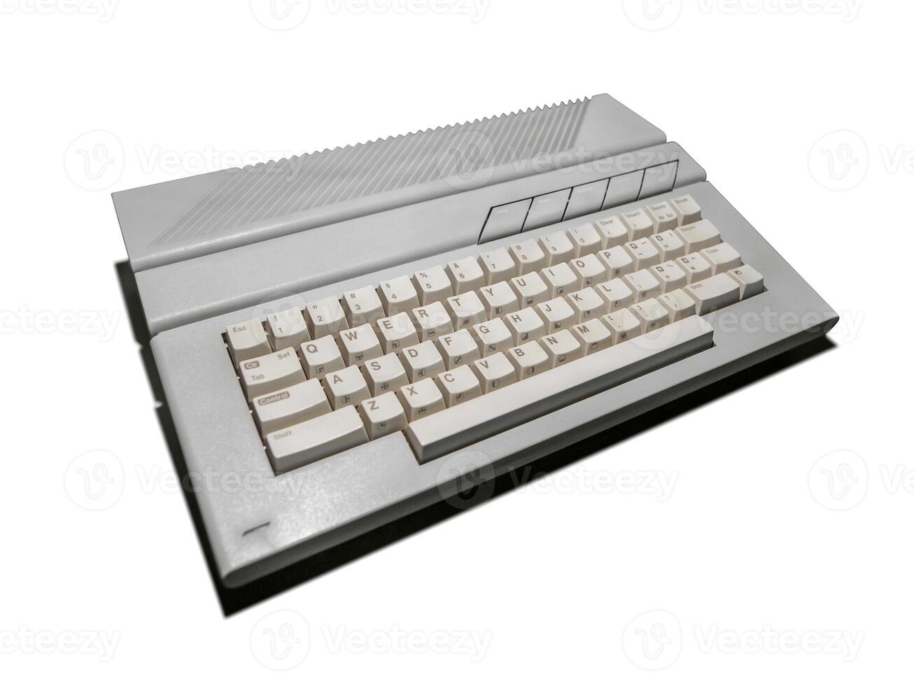 Vintage gray keyboard from a computer. Old office equipment. Computer technology of the past. Isolate on a white background. photo