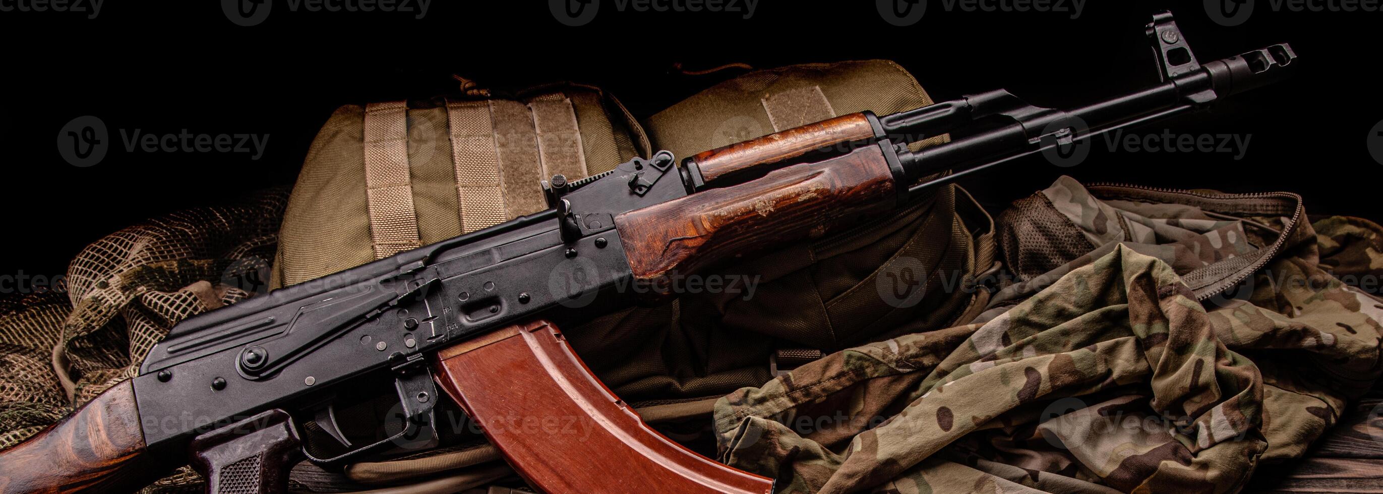Classic Soviet AK machine gun on a wooden back. Weapons of Russia and the Soviet Union. photo
