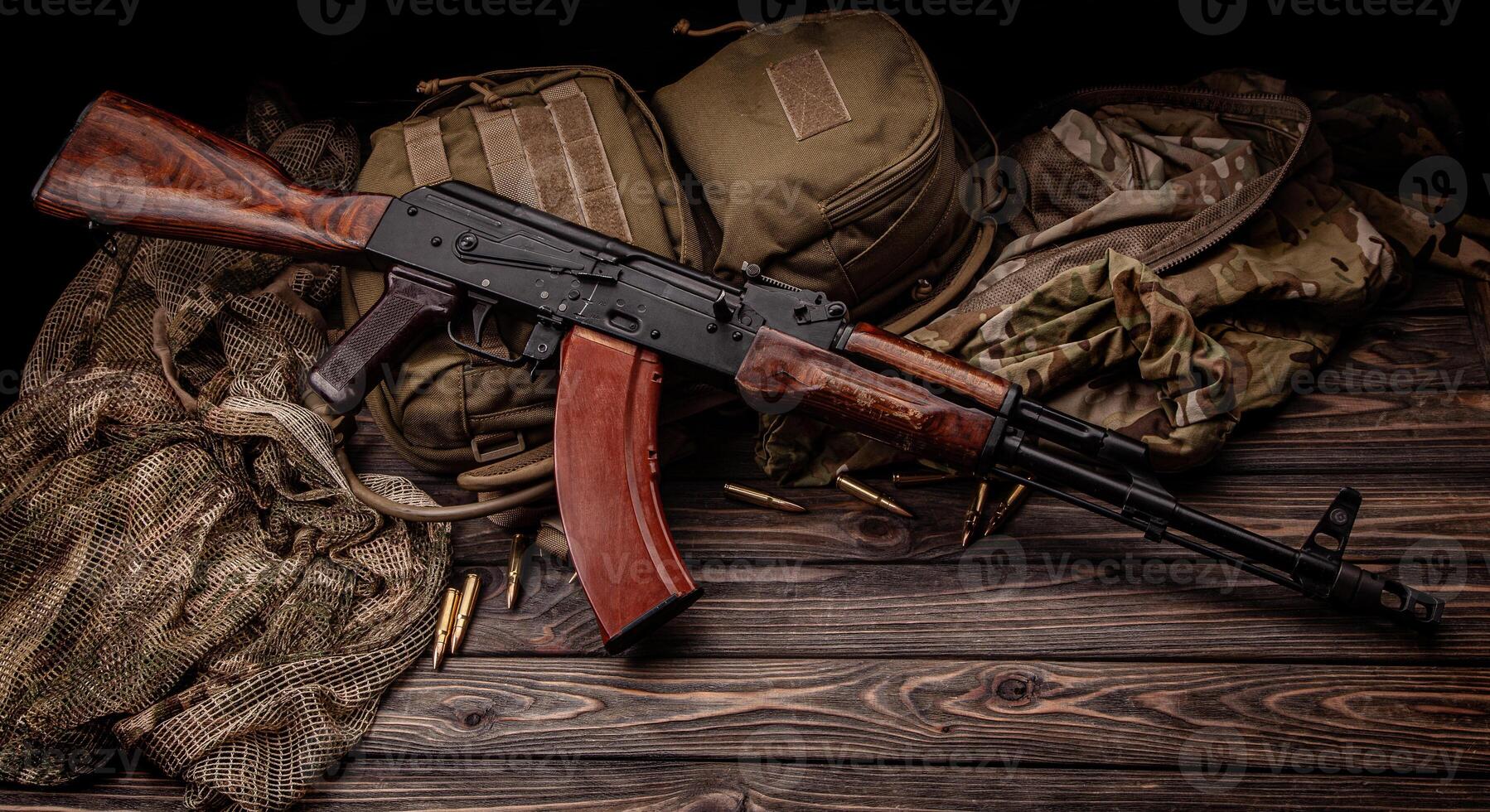 Classic Soviet AK machine gun on a wooden back. Weapons of Russia and the Soviet Union. photo