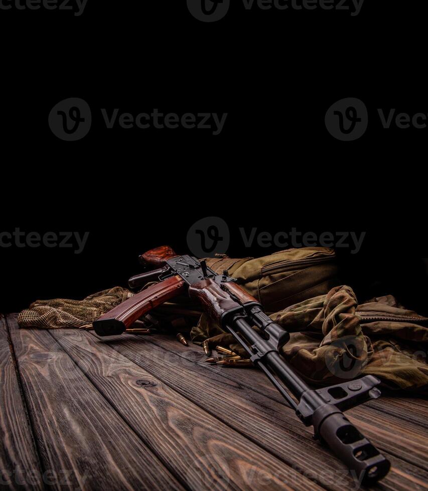 Classic Soviet AK machine gun on a wooden back. Weapons of Russia and the Soviet Union. photo