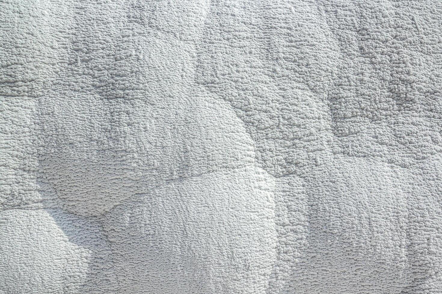 Stone texture covered with calcium deposits. Pamukale texture photo