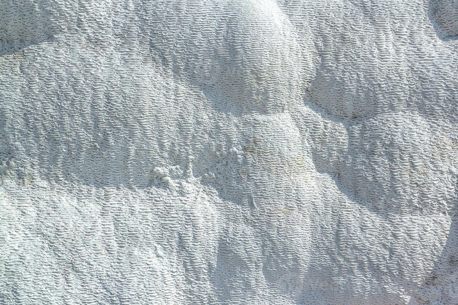 Stone texture covered with calcium deposits. Pamukale texture photo