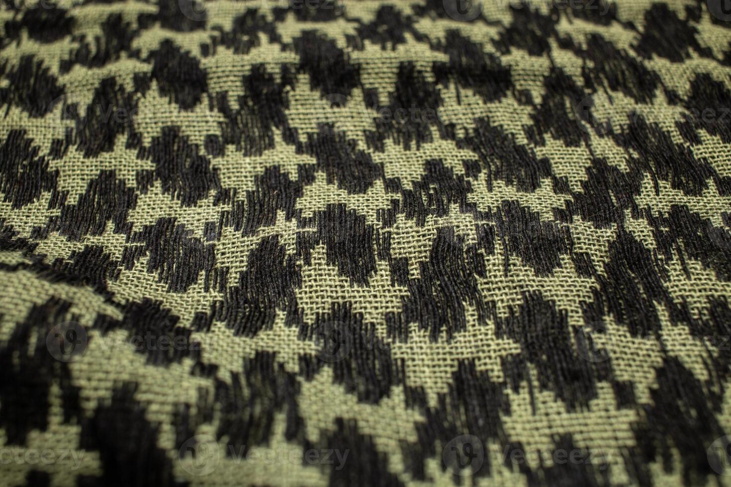Keffieh scarf. The texture of the cotton traditional symbolic arabian scarf. Khaki back. photo