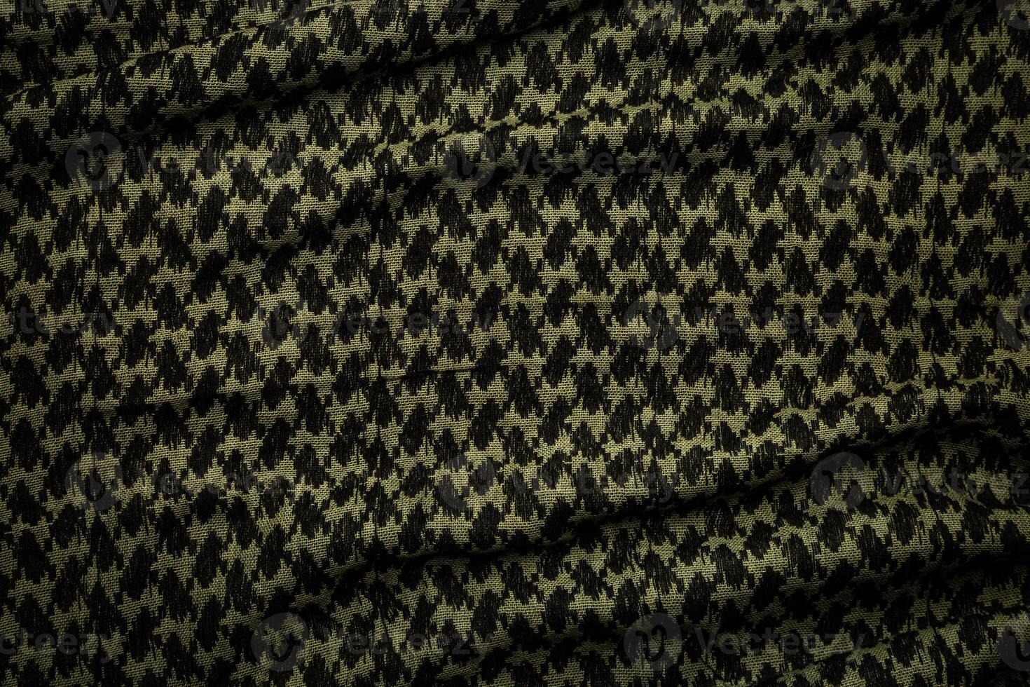 Keffieh scarf. The texture of the cotton traditional symbolic arabian scarf. Khaki back. photo