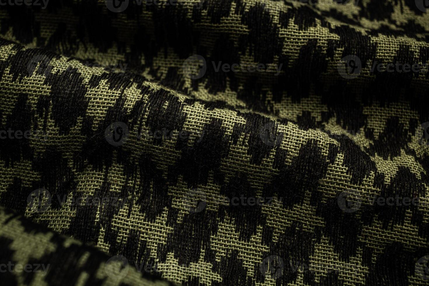 Keffieh scarf. The texture of the cotton traditional symbolic arabian scarf. Close-up material. Khaki back. photo
