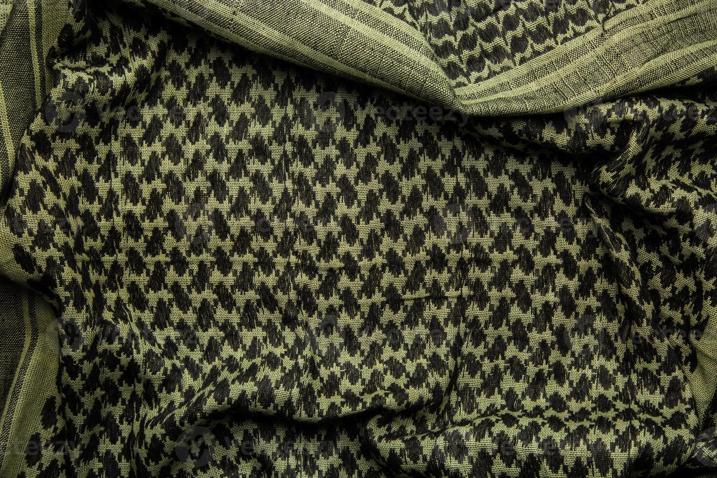 Keffieh scarf. The texture of the cotton traditional symbolic arabian scarf. Khaki back. photo