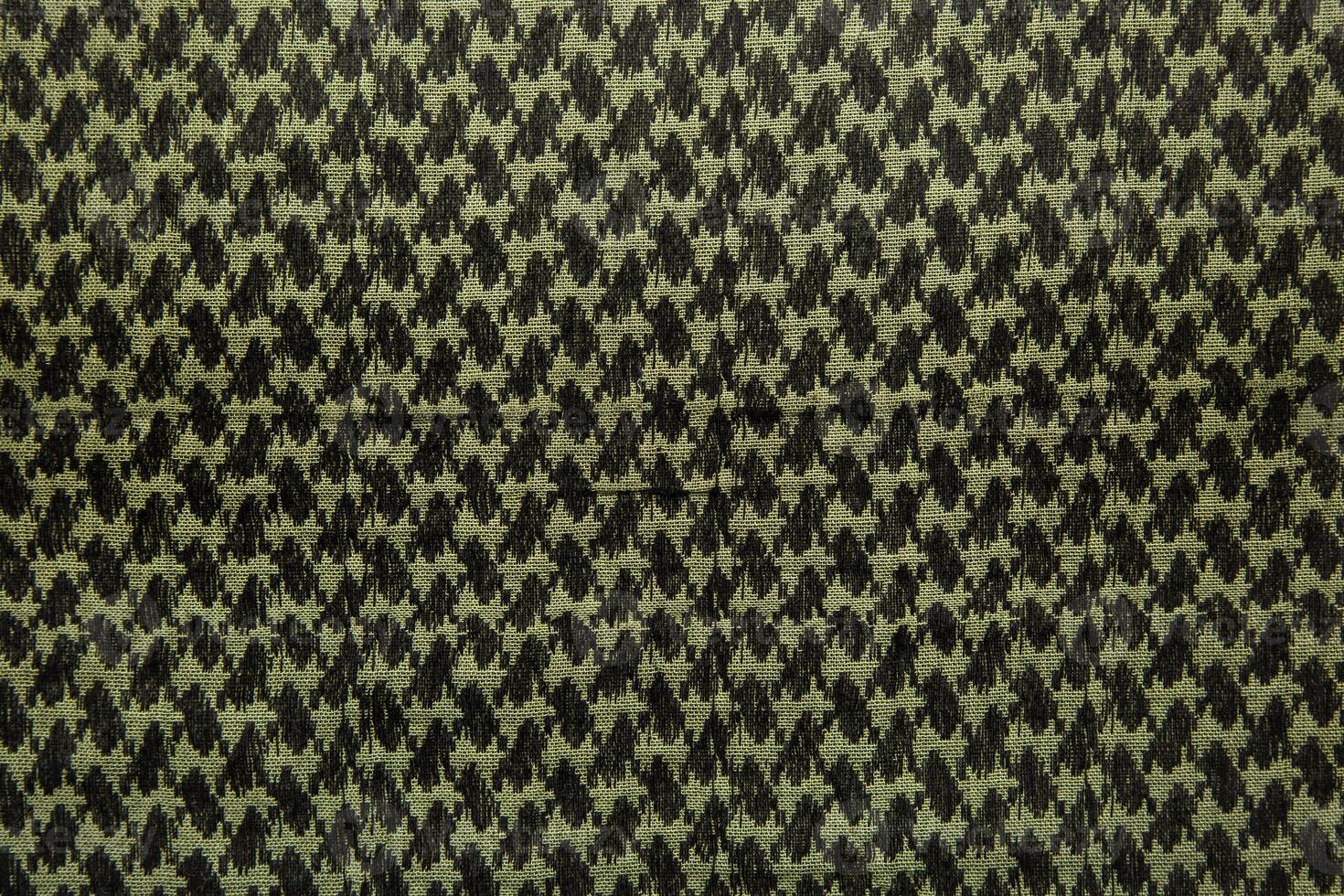 Keffieh scarf. The texture of the cotton traditional symbolic arabian scarf. Khaki back. photo
