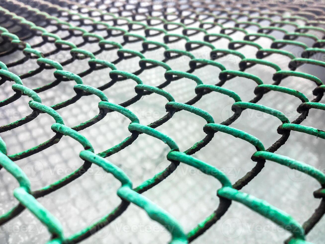 The texture of the old metal mesh of the chain. Old grid background. photo
