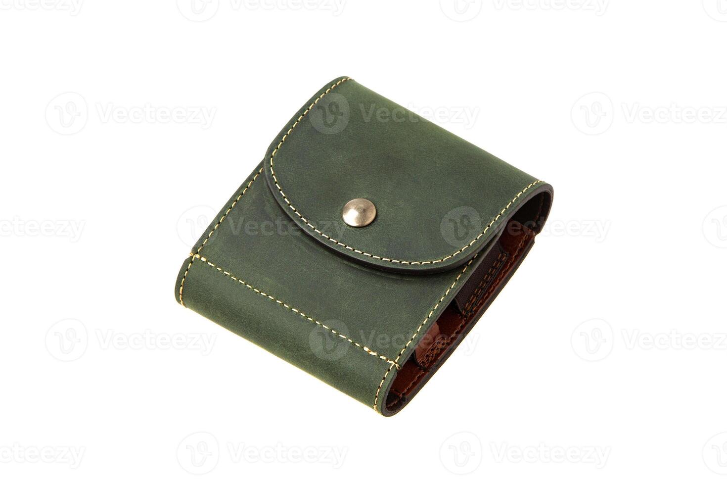 Leather wallet isolated on white background. Luxury leather wallet on a rivet button on a light back. Green leather wallet. photo