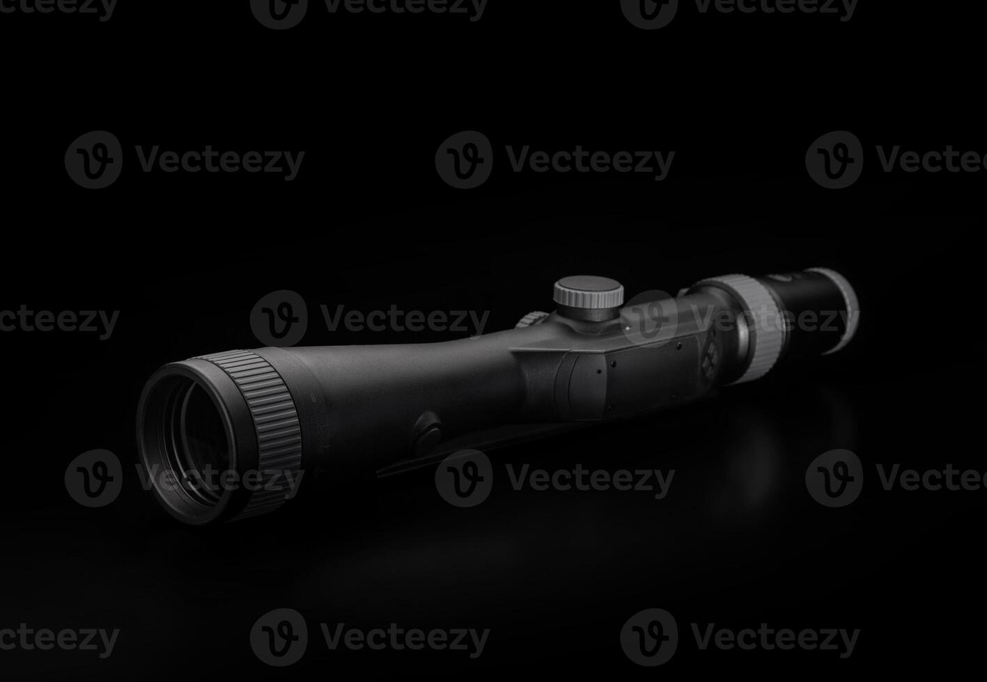 Modern sniper scope on a dark background. Optical device for aiming and shooting at long distances. photo