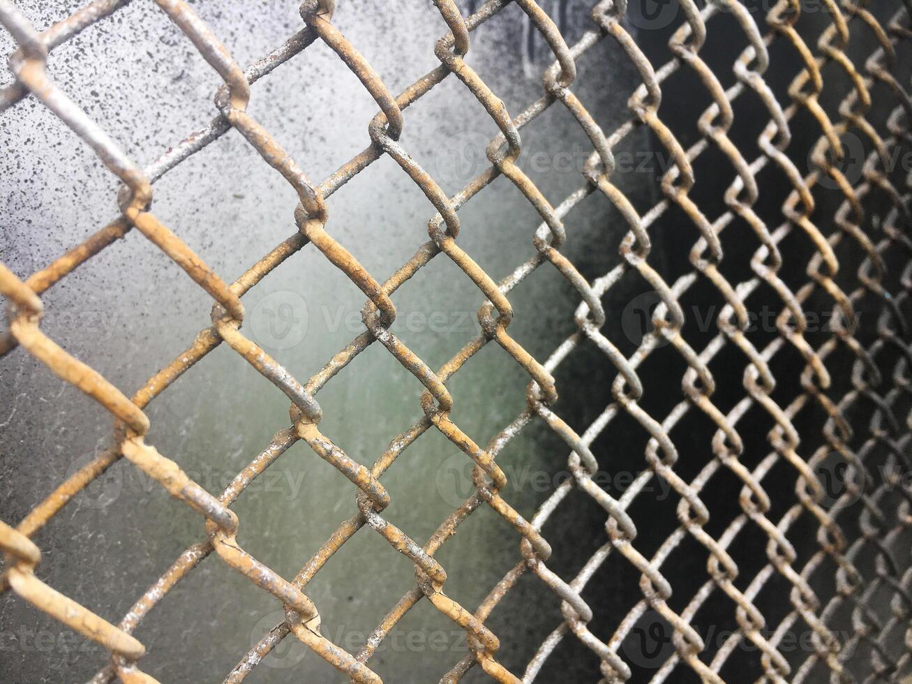 The texture of the old metal mesh of the chain. Old grid background. photo