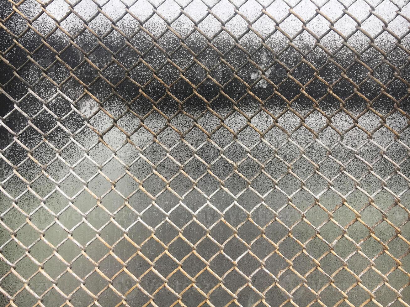 The texture of the old metal mesh of the chain. Old grid background. photo