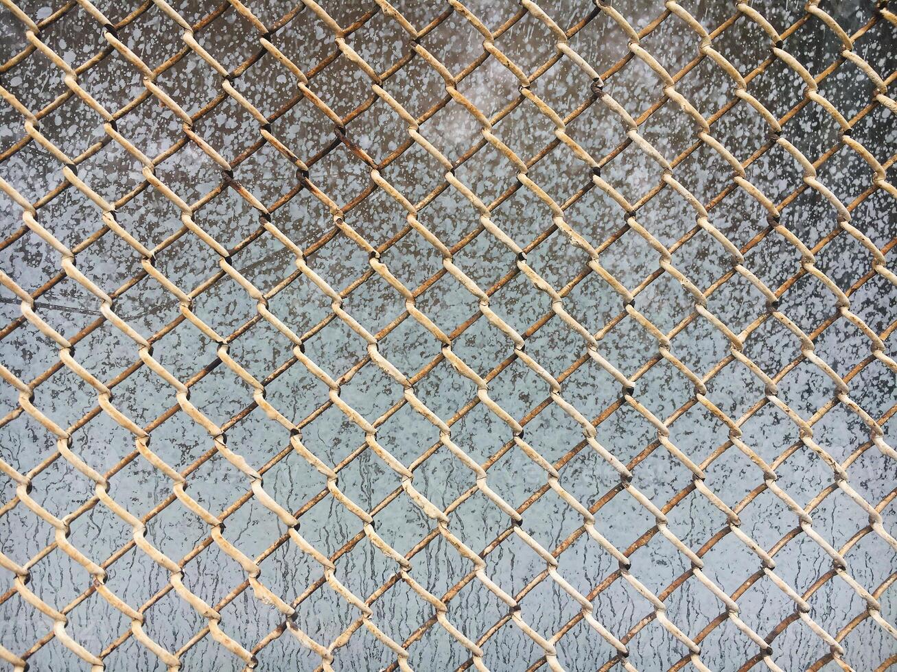 The texture of the old metal mesh of the chain. Old grid background. photo