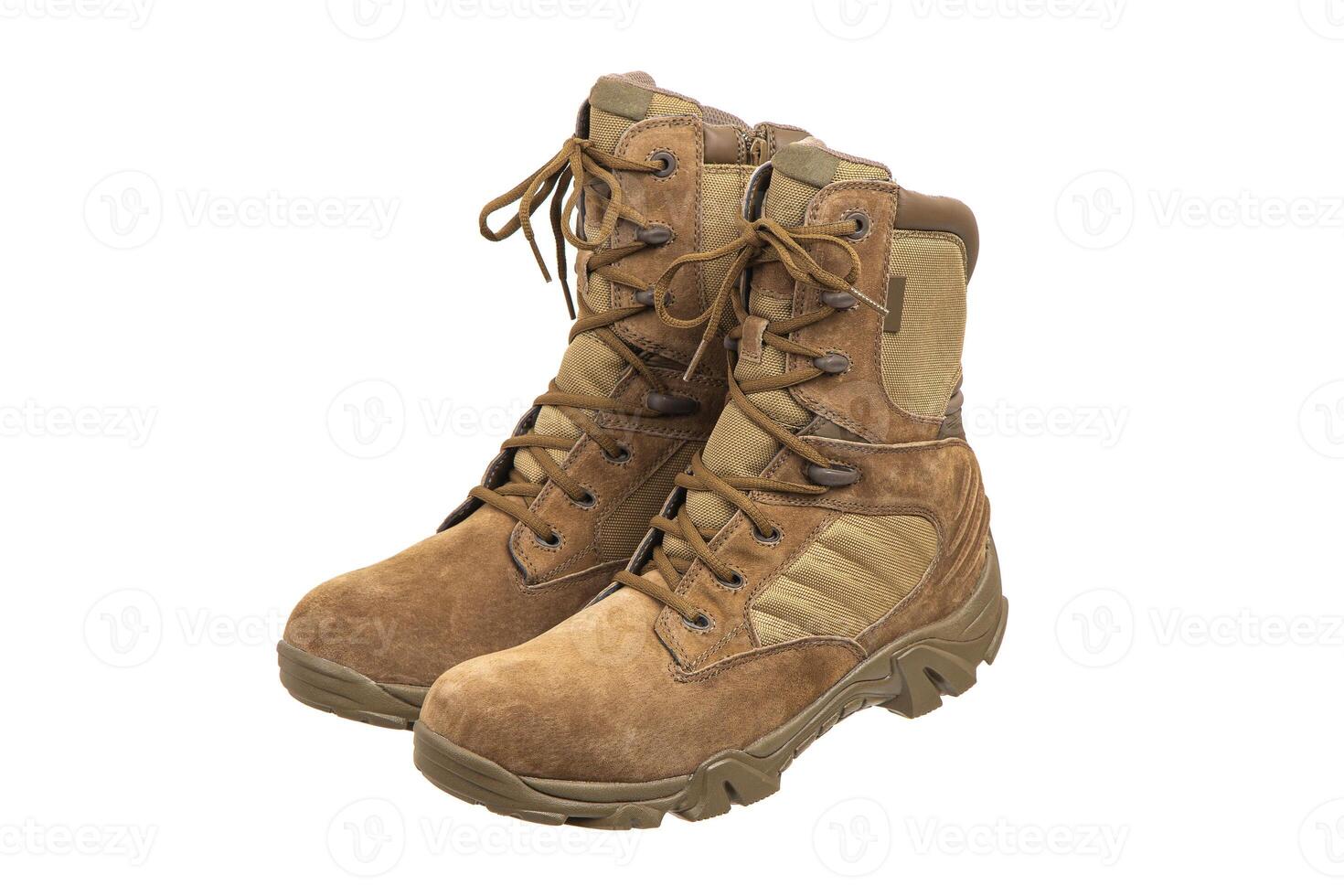 Modern army combat boots. New desert beige shoes. Isolate on a white back. photo