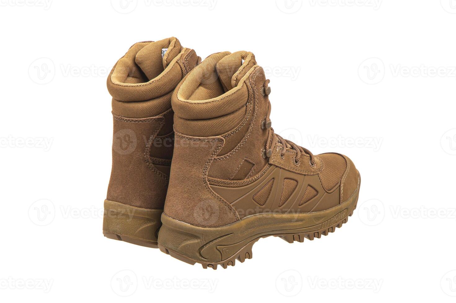 Modern army combat boots. New desert beige shoes. Isolate on a white back. photo