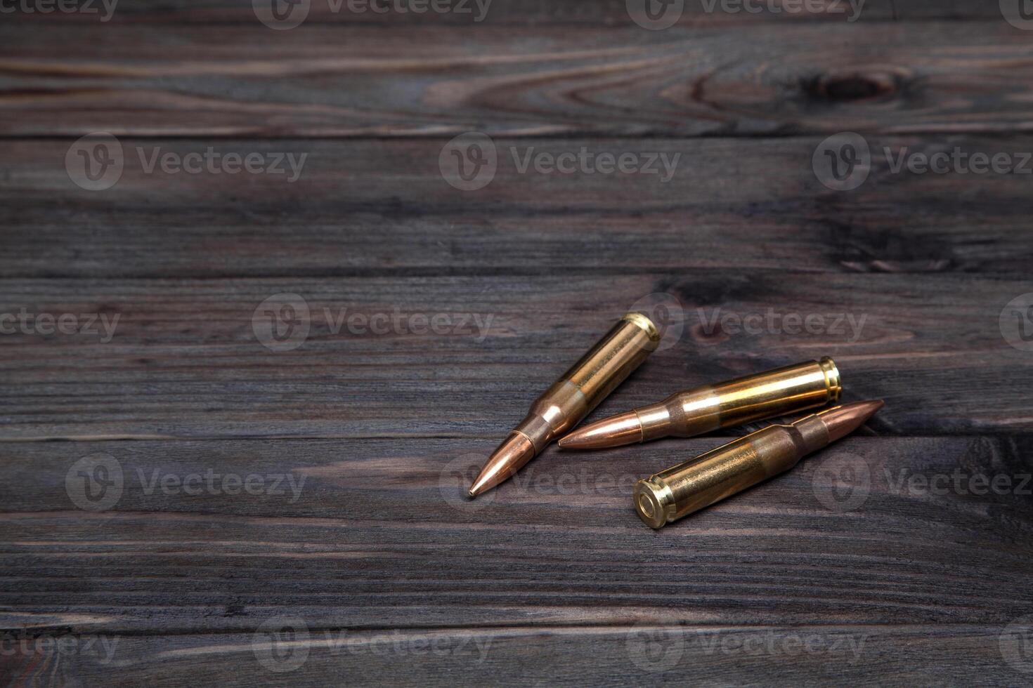 Cartridges on a dark wooden background photo