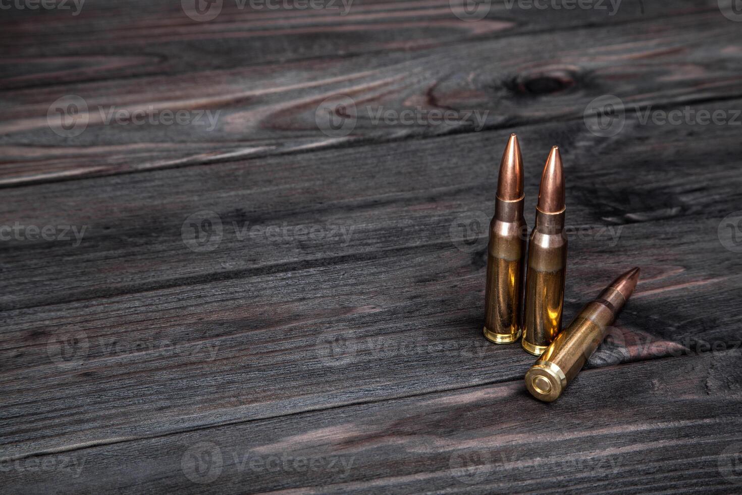 Cartridges on a dark wooden background photo
