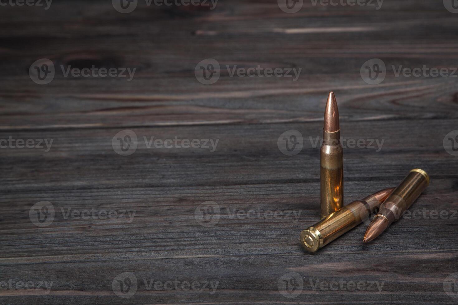 Cartridges on a dark wooden background photo