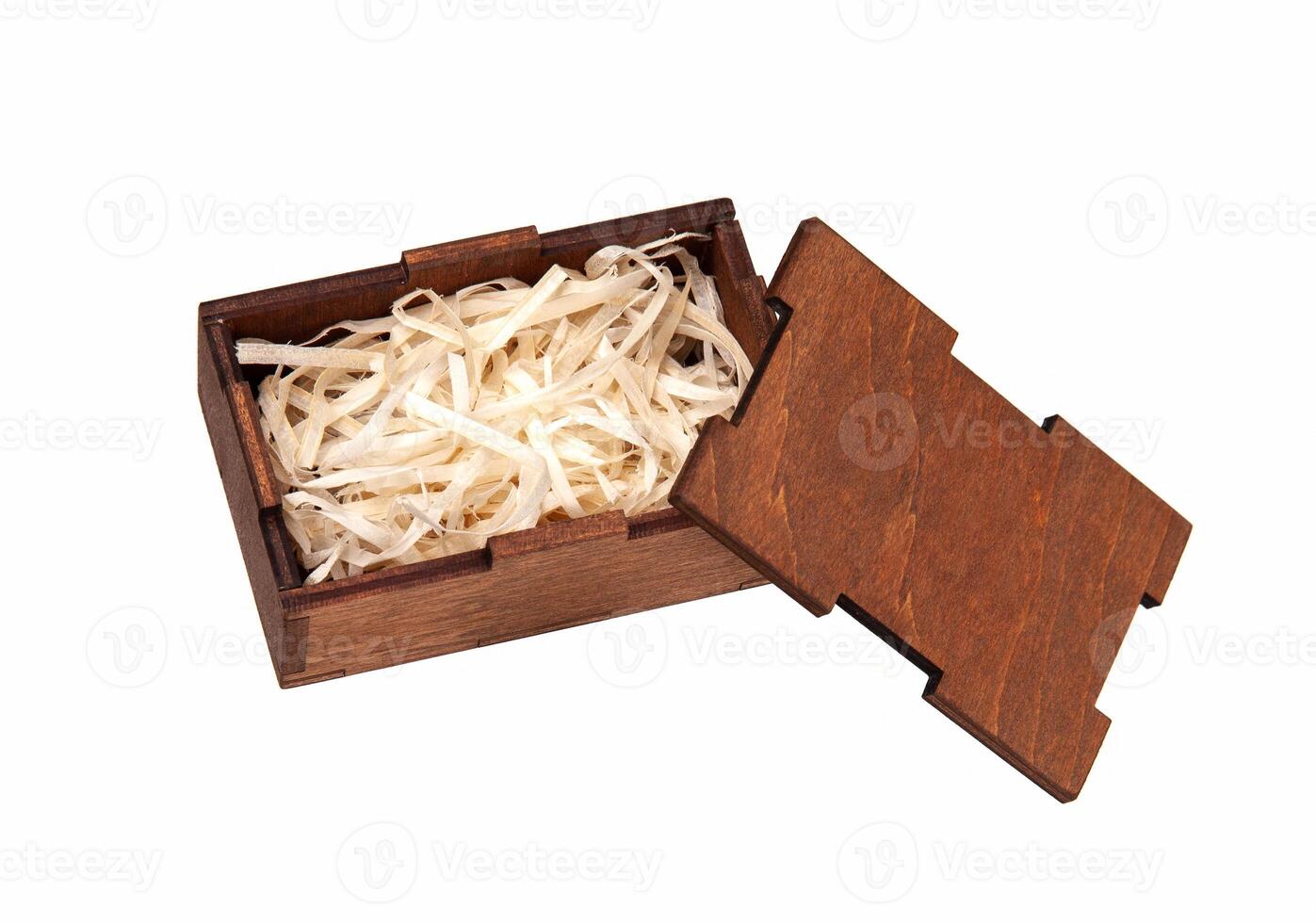 Open wooden box with filling material inside. Empty natural wooden box with decorative straw for happy gifts. photo
