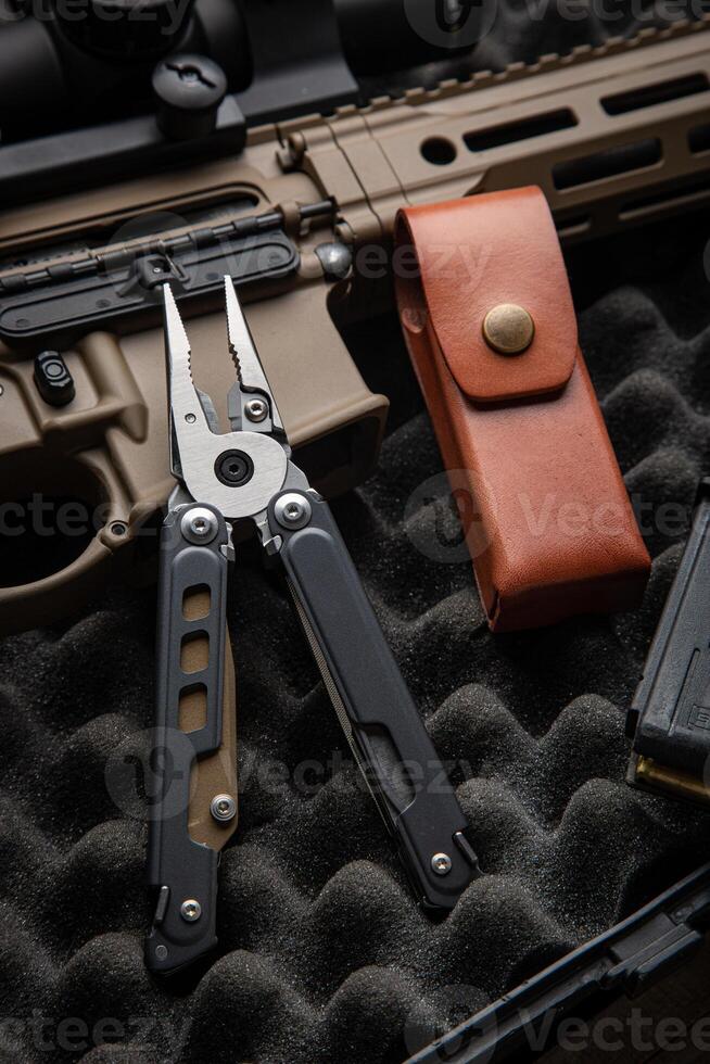 Modern universal army multitool. A tool for all occasions. Gray foam back photo