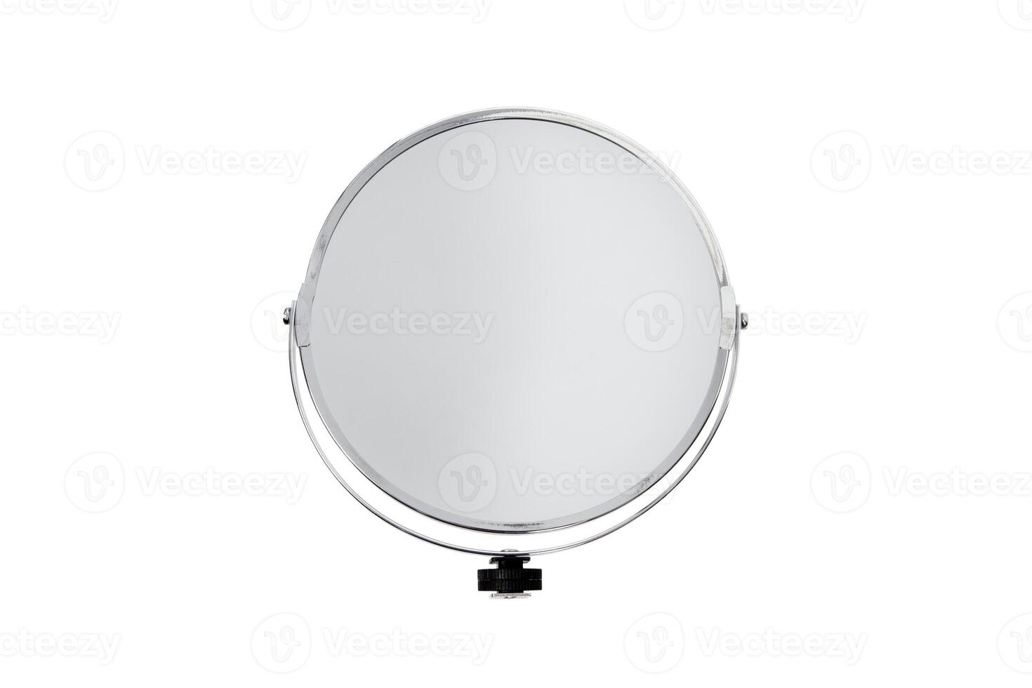 Desktop make up cosmetic mirror isolated on white back. Round turning small mirror in a metal frame. photo
