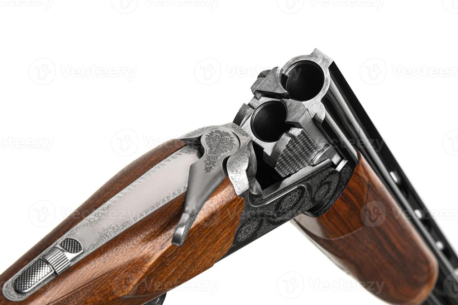 Luxury double-barreled shotgun with a vertical arrangement of barrels. Expensive weapon for hunters. Isolate on a white back. photo