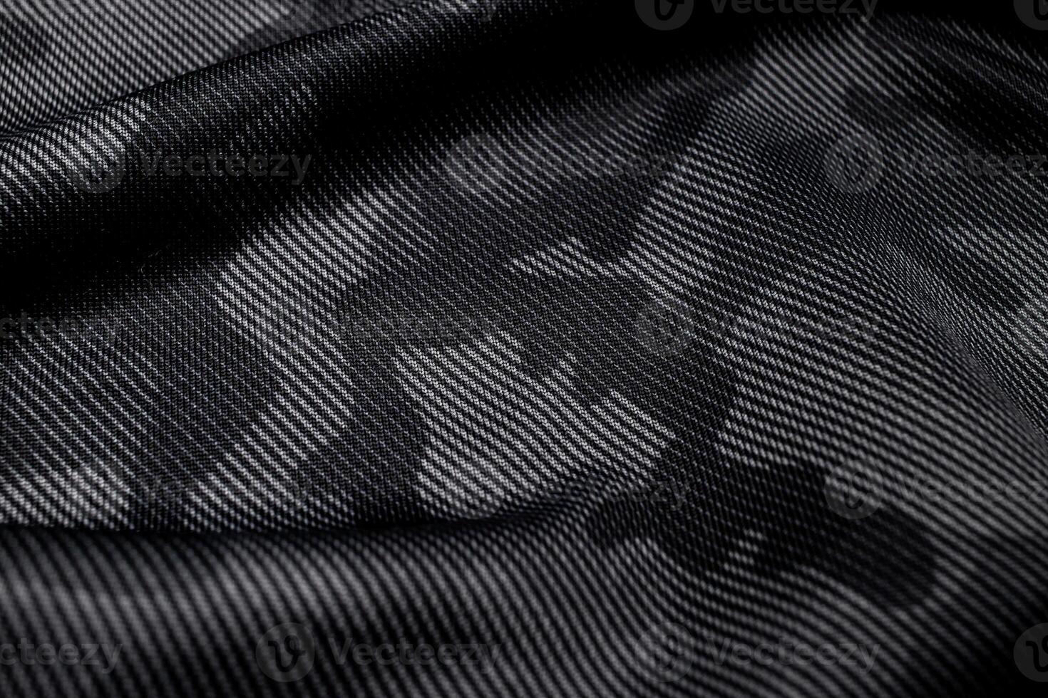 Camouflage pattern. Trendy dark gray camouflage fabric. Military texture. Dark back. photo