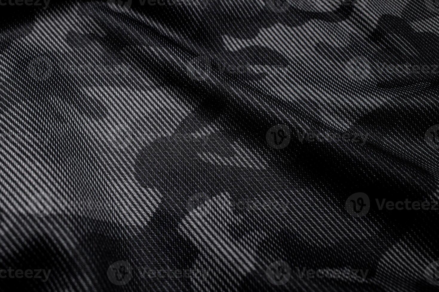 Camouflage pattern. Trendy dark gray camouflage fabric. Military texture. Dark back. photo