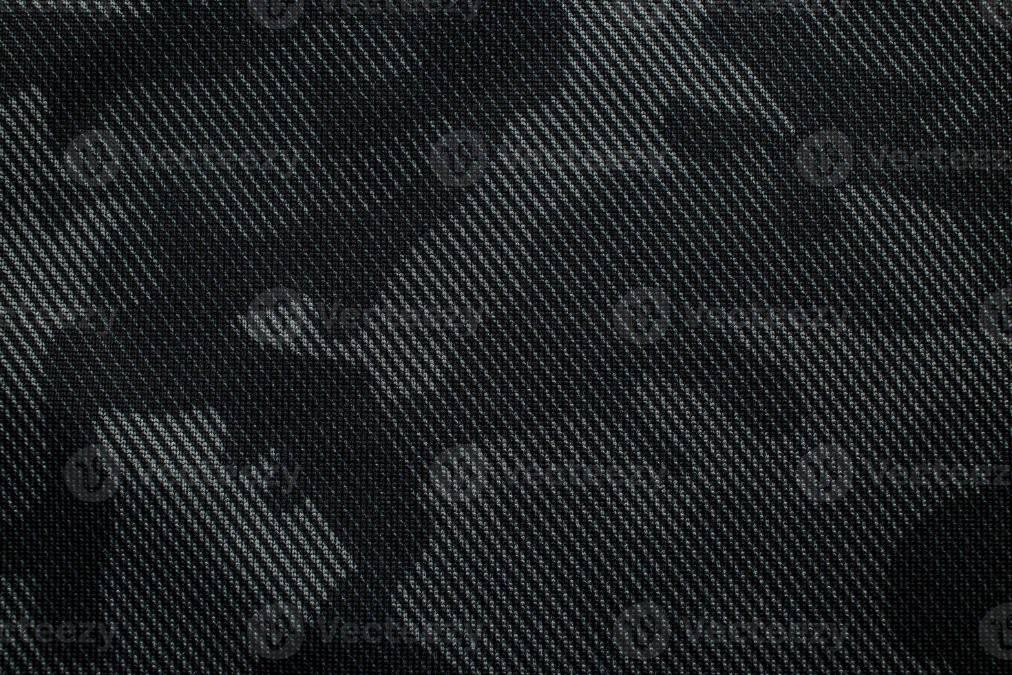 Camouflage pattern. Trendy dark gray camouflage fabric. Military texture. Dark back. photo