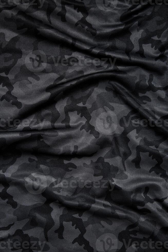Camouflage pattern. Trendy dark gray camouflage fabric. Military texture. Dark back. photo