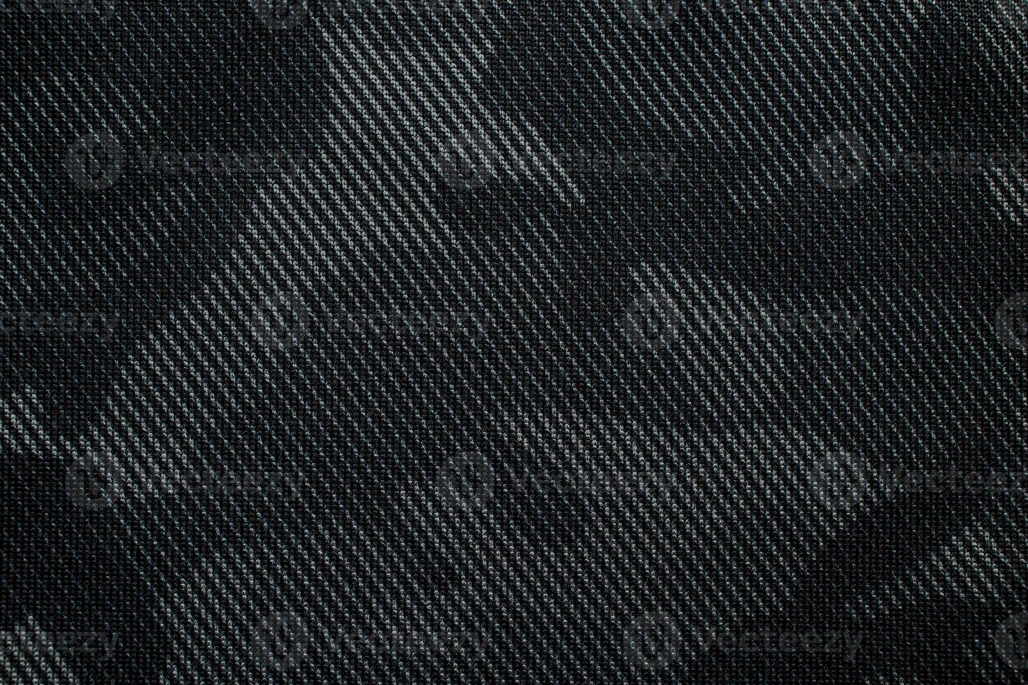 Camouflage pattern. Trendy dark gray camouflage fabric. Military texture. Dark back. photo