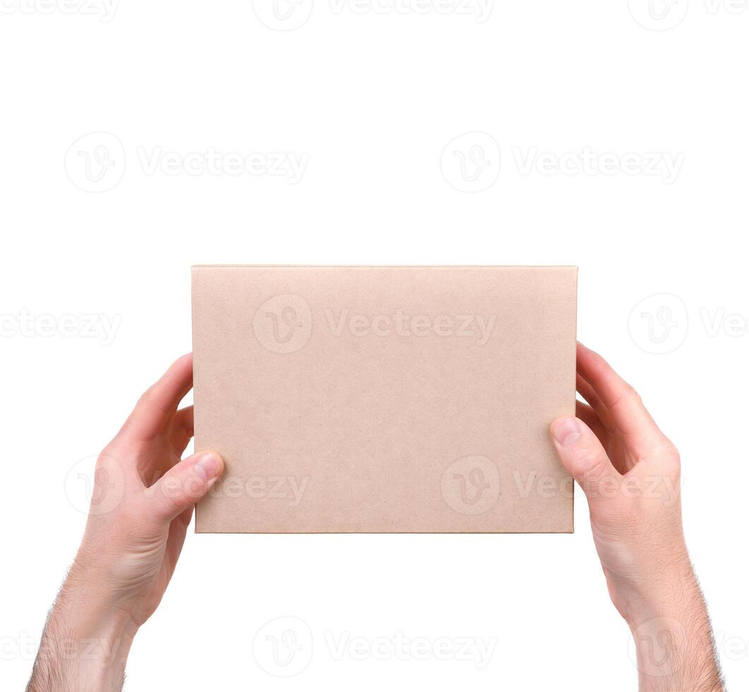 men's hands hold a gift box. isolate on white photo