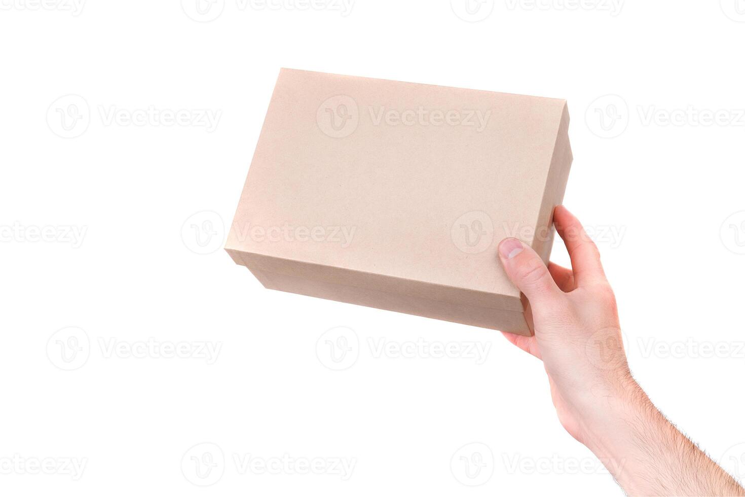 men's hands hold a gift box. isolate on white photo