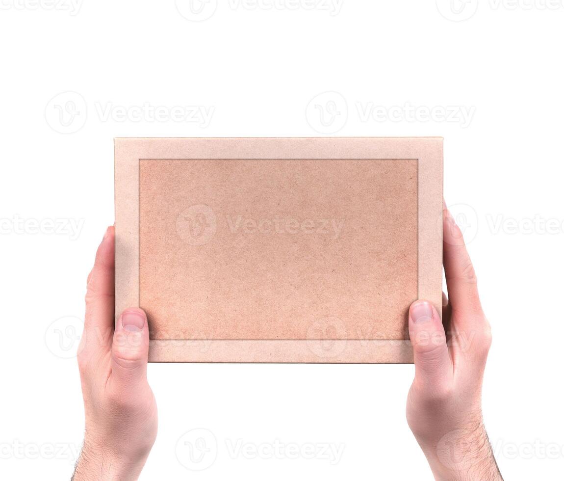men's hands hold a gift box. isolate on white photo