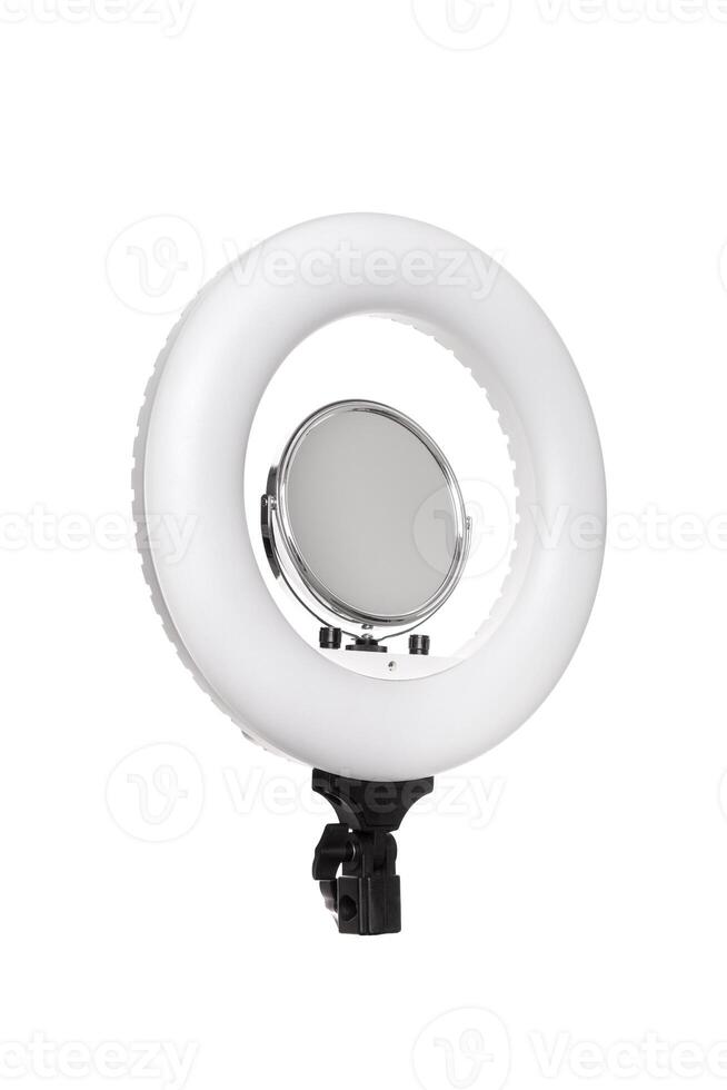 Closeup of circular neon LED lamp isolated white background. Popular modern light for make-up and beauty portraits. photo