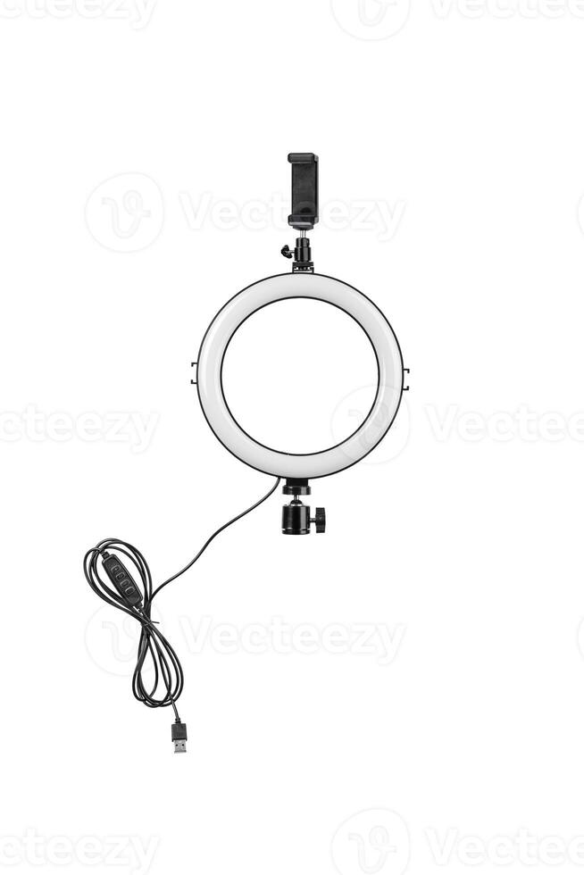 Closeup of circular neon LED lamp isolated white background. Popular modern light for make-up and beauty portraits. photo