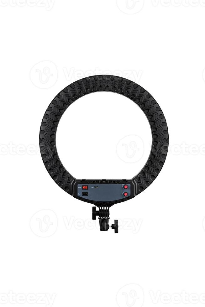 Closeup of circular neon LED lamp isolated white background. Popular modern light for make-up and beauty portraits. photo