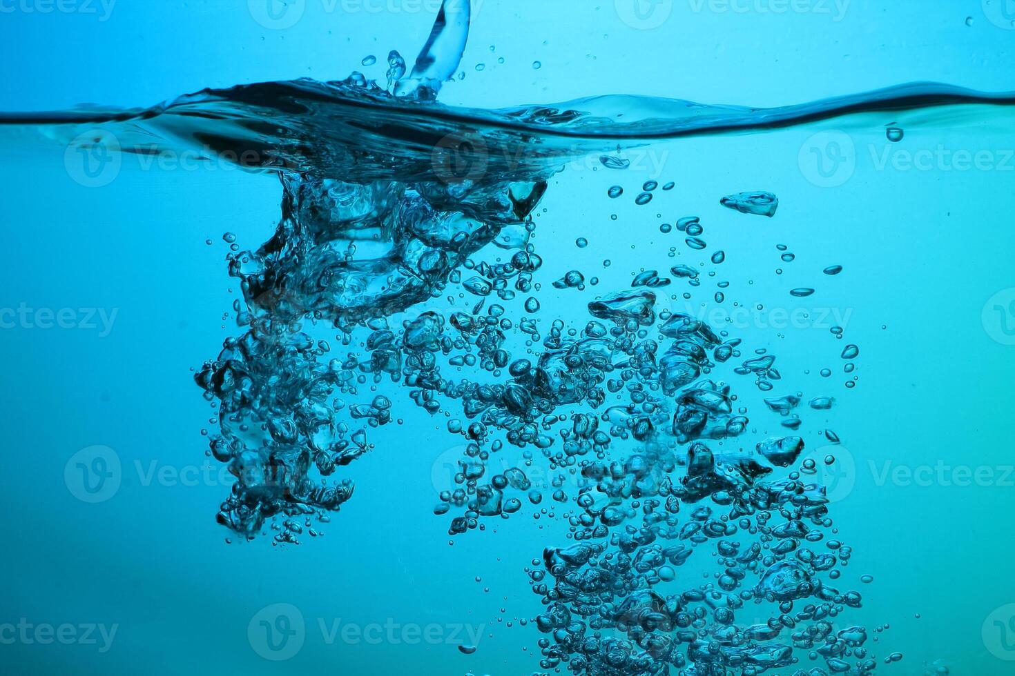 Fresh Water With Underwater Bubbles Texture on a Blue Background Close-up Abstract Liquid Bubbles Aqua Design Wallpaper photo