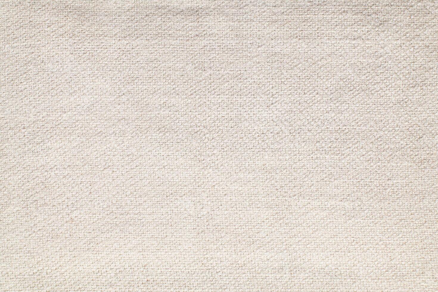 Natural Linen Material Textile Canvas Fabric Texture Background Close-up Detail of Fabric Natural Color Hemp Material Pattern Design Wallpaper. Can be Used as Background or For Graphic Design photo