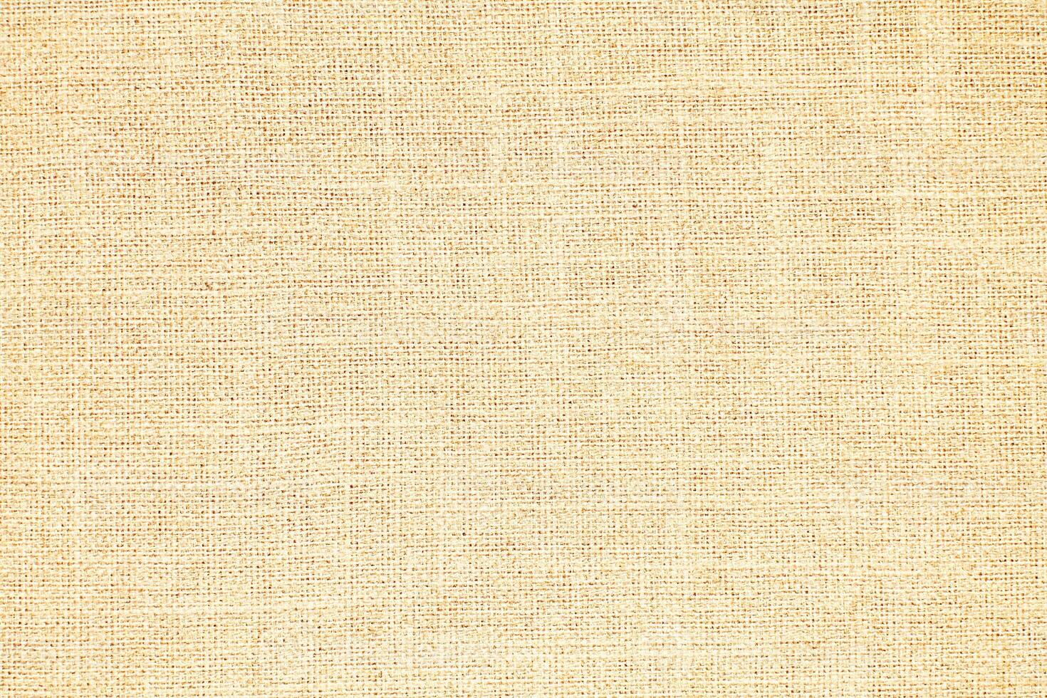 Natural Linen Material Textile Canvas Fabric Texture Background Close-up Detail of Fabric Natural Color Hemp Material Pattern Design Wallpaper. Can be Used as Background or For Graphic Design photo