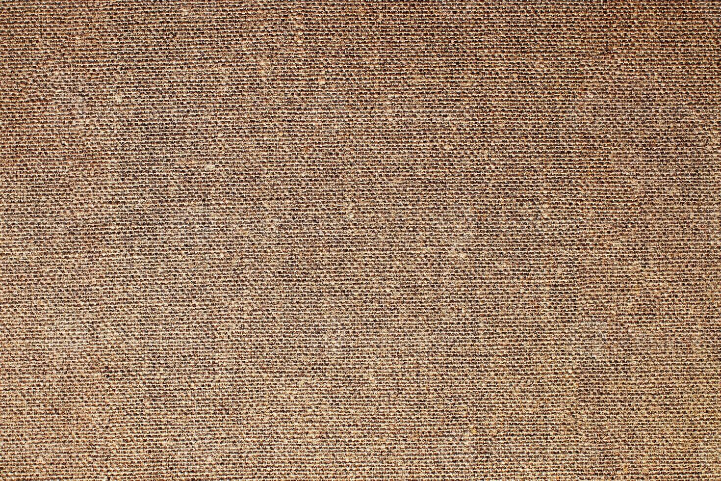 Natural Linen Material Textile Canvas Fabric Texture Background Close-up Detail of Fabric Natural Color Hemp Material Pattern Design Wallpaper. Can be Used as Background or For Graphic Design photo