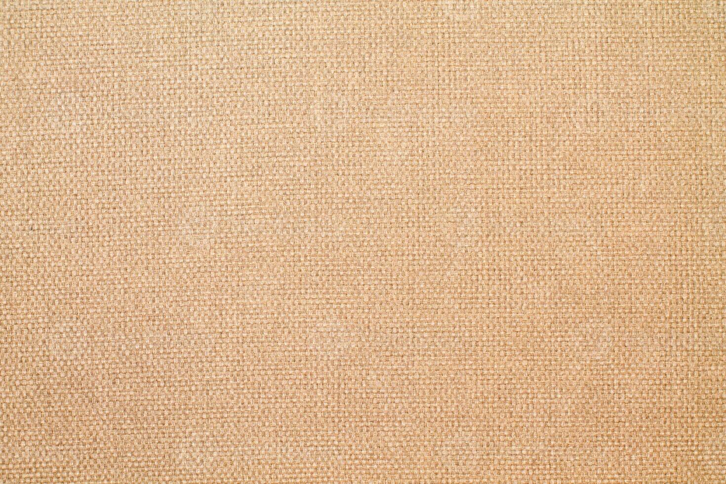 Natural Linen Material Textile Canvas Fabric Texture Background Close-up Detail of Fabric Natural Color Hemp Material Pattern Design Wallpaper. Can be Used as Background or For Graphic Design photo